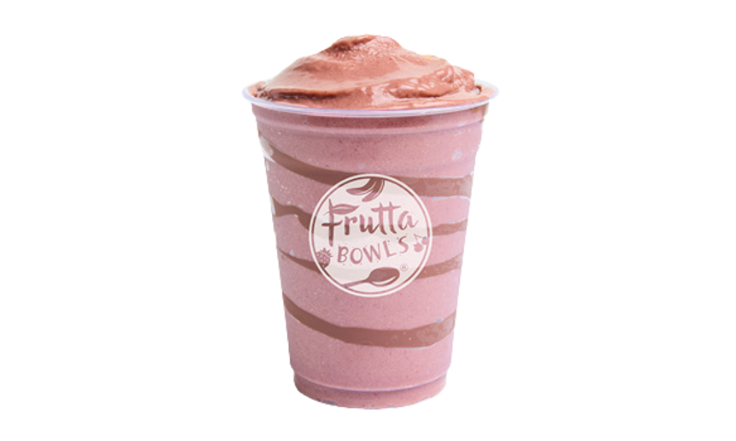 A thick, creamy pink smoothie served in a clear plastic cup with chocolate swirls and the Frutta Bowls logo printed on the front.