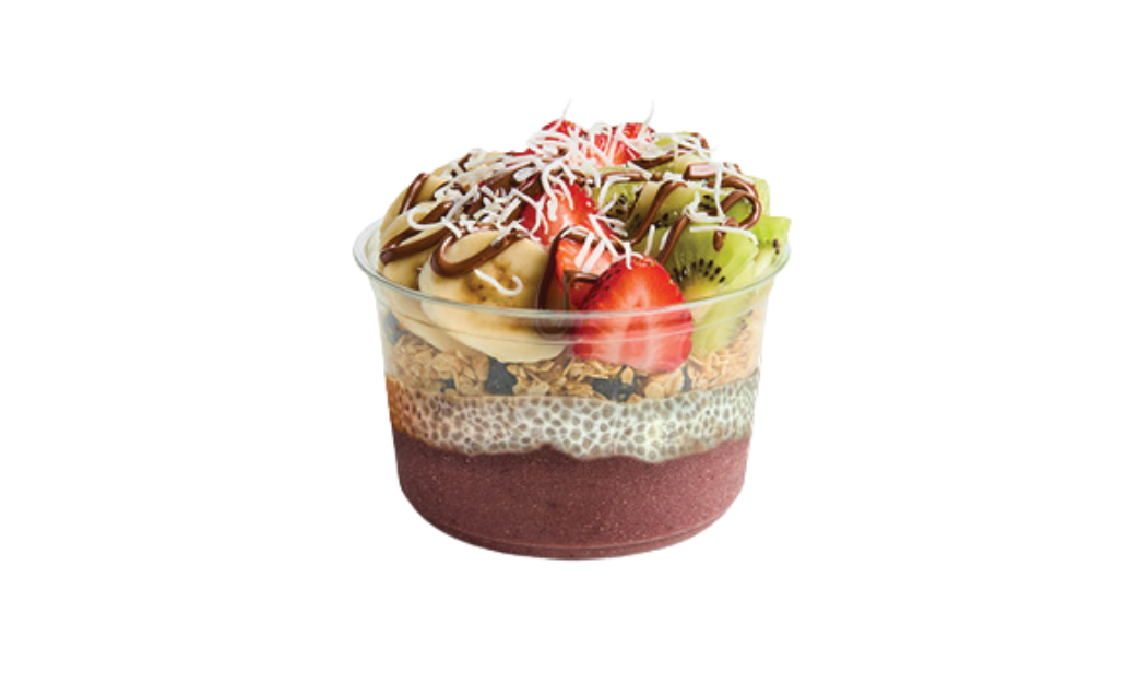 A layered acai bowl in a clear cup, consisting of a dark smoothie base, a chia seed pudding layer, granola, and toppings including banana slices, kiwi, strawberries, shredded coconut, and chocolate drizzle.